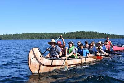 Group of summer campers on a canoe trip at Lake Temagami