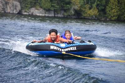 Young boys tubing at Lake Temagami
